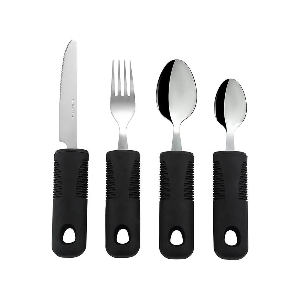 Set of 4 items of easy grip cutlery with black handles on a white background